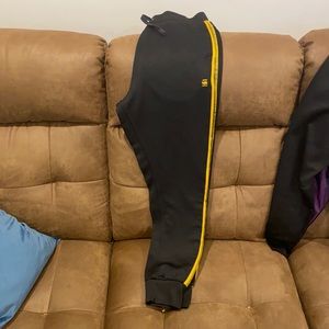 Men's black and gold track pants sz medium
